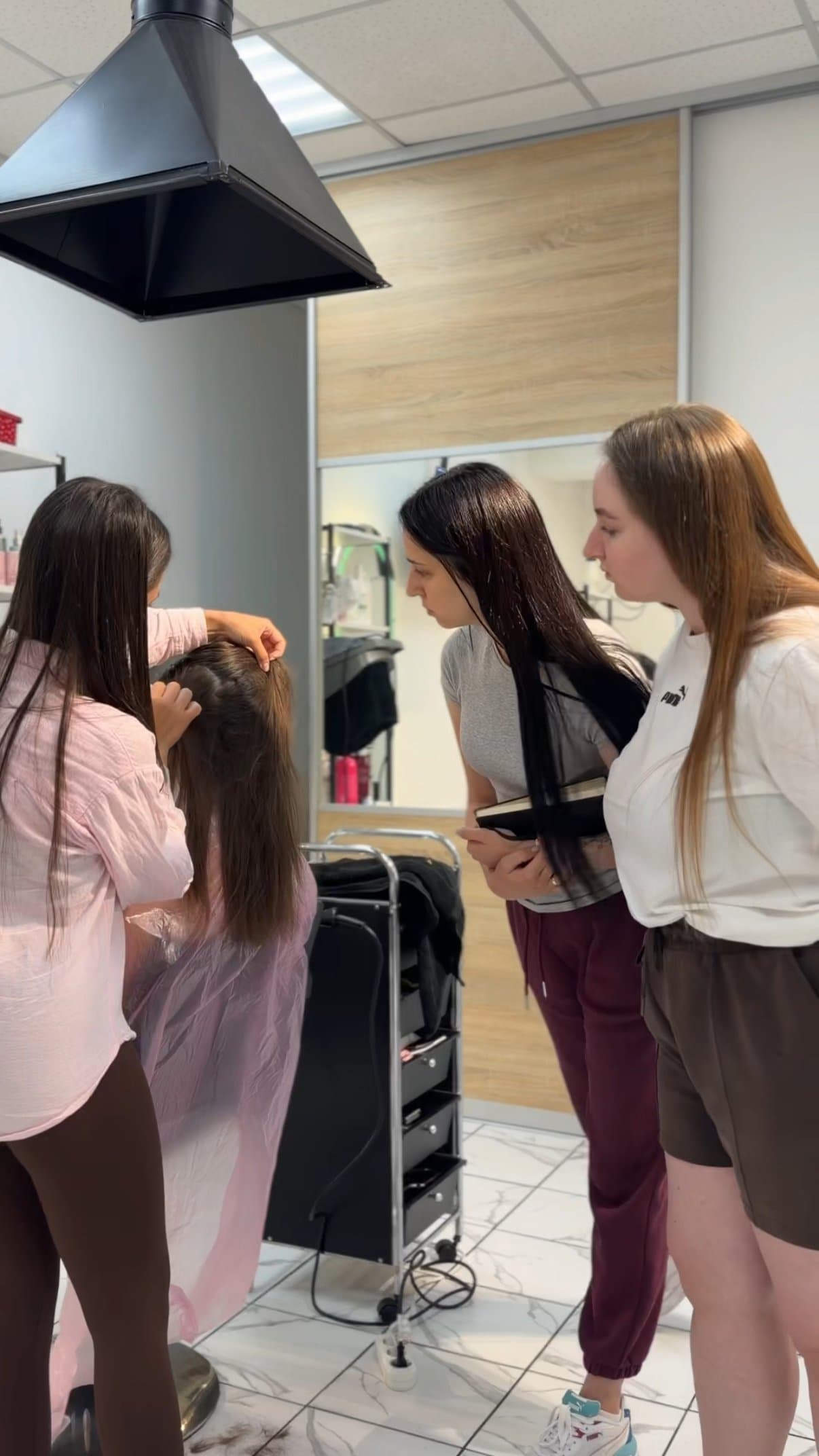 Yelyzaveta consulting a client - hair diagnosis